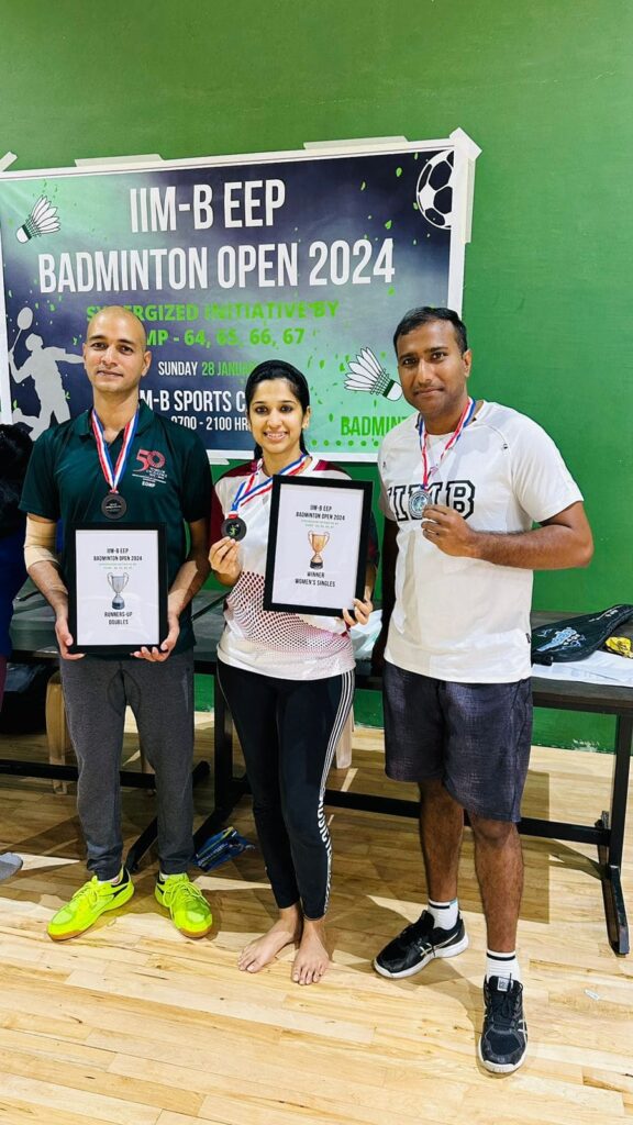 IIMB EEP Badminton Open Tournament winners pose with their medals