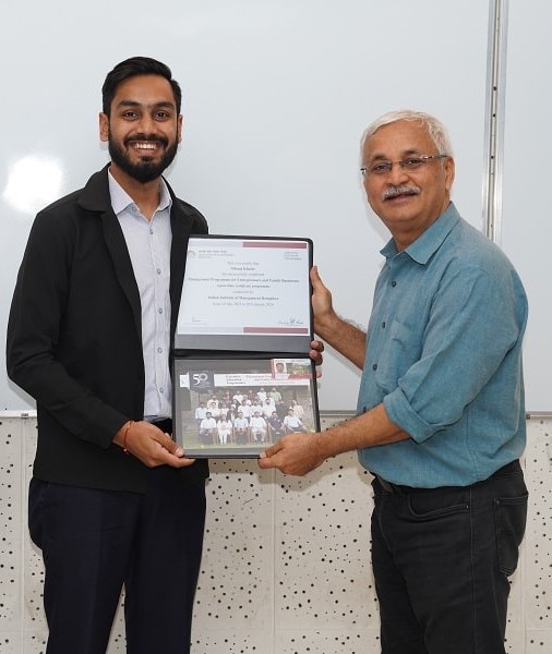 A MPEFB batch 14 participant receives his certificate from the professor