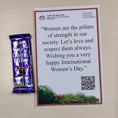 An image of a chocolate as a gift and a note which reads "Women are pillars of strength in our society. Let's love and respect them always. Wishing you a very happy International Women's Day" - all these invokes the idea of Diversity & Inclusion in the employees